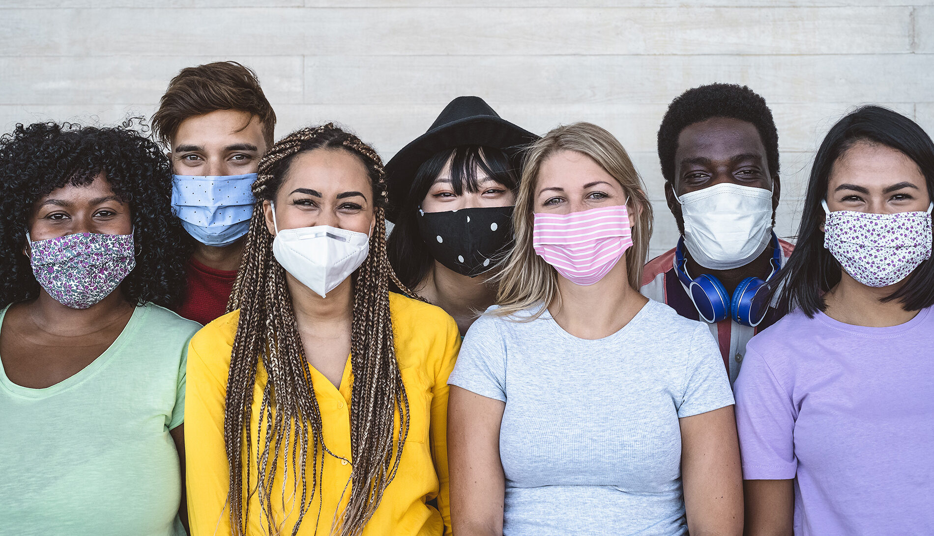 group of youth wearing masks against COVID-19